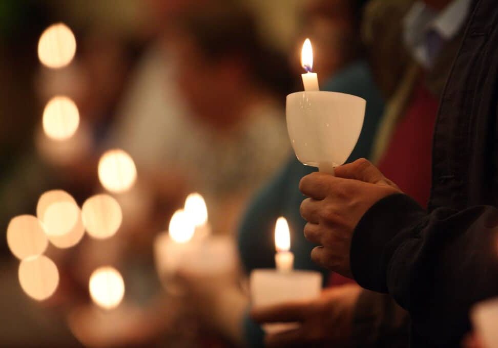 ARTWORK WITH PART1 Pictured are worshippers holding candles during the Easter Vigil at St. Jude Church in Mastic Beach, N.Y. Each Christian present is seen to be a bearer of the light of Christ. (CNS file photo/Gregory A. Shemitz) See FAITH-ALIVE 15 March 5, 2020.